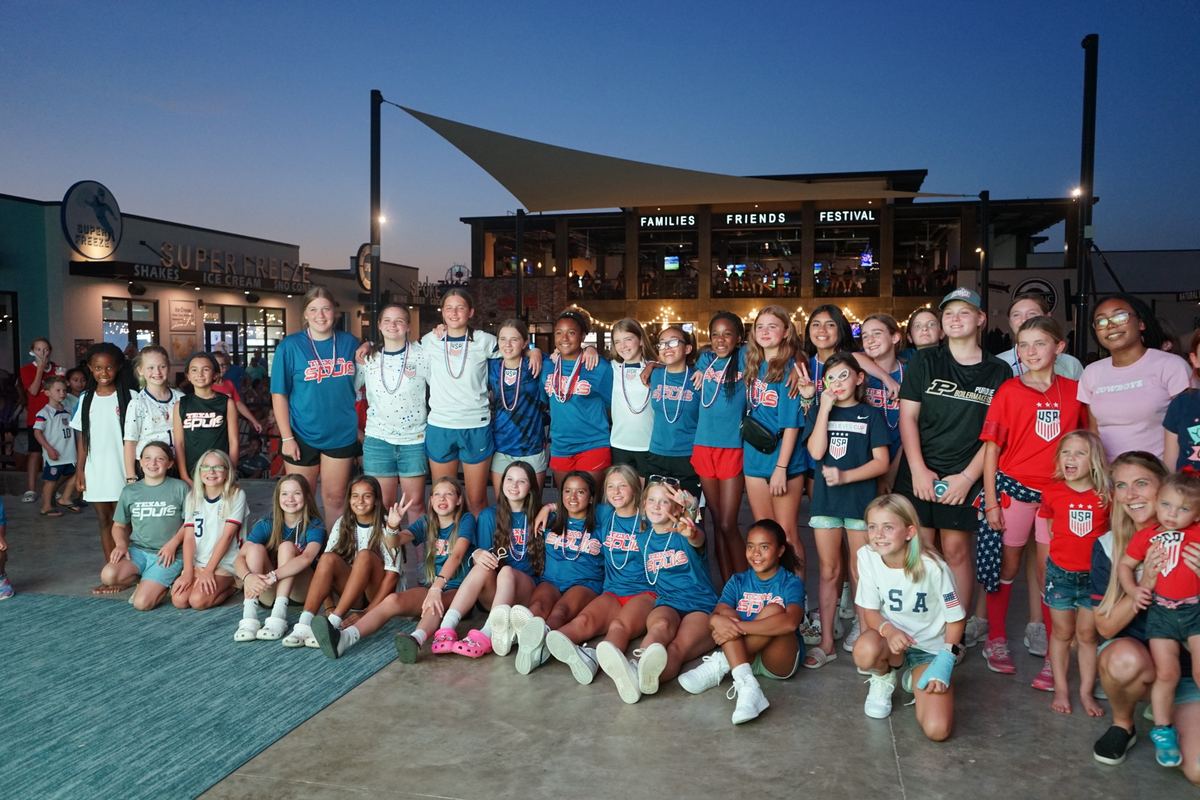 Youth soccer team on stage at dusk